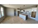 Spacious kitchen with white cabinets, island ready for customization, and abundant natural light at 6272 Willow Branch Way, Plainfield, IN 46168