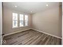 Bright bedroom with ample natural light and stylish floors at 6323 Willow Branch Way, Plainfield, IN 46168