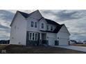 New construction two-story home featuring stone accents, an attached two-car garage and a modern design at 6323 Willow Branch Way, Plainfield, IN 46168