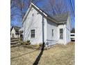 Side view of home showing vinyl siding and windows at 710 E 6Th St, Anderson, IN 46012