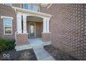 Inviting front porch featuring classic columns and a sheltered entryway at 7239 Bellini Ln, Indianapolis, IN 46259