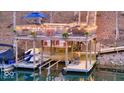 Well-equipped boat dock featuring a bar, seating, and multiple boat slips at 8205 Bass Dr, Nineveh, IN 46164