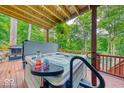Relax in style with a hot tub on the deck, complete with outdoor privacy and views of nature at 8205 Bass Dr, Nineveh, IN 46164