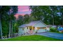 Well maintained home features beautiful landscaping, a wraparound deck, and attached garage at 8205 Bass Dr, Nineveh, IN 46164
