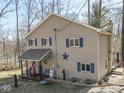Attractive two-story home with blue shutters and an inviting covered front porch at 8460 S Green Dr, Nineveh, IN 46164