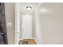 Bright foyer with hardwood floors, neutral paint, and simple decor at 8715 Legion Ln, Indianapolis, IN 46231