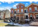 Attractive townhomes feature red brick and charming front patios and stairways at 1074 Reserve Way, Indianapolis, IN 46220
