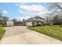This is a long driveway leading to a well-maintained home with a spacious garage and a fenced yard at 14485 Oak Ridge Rd, Carmel, IN 46032
