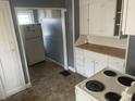 Functional kitchen featuring classic white cabinetry and essential appliances at 2022 N Olney St, Indianapolis, IN 46218