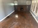 Spacious living room with a brick fireplace and bright, natural light at 2022 N Olney St, Indianapolis, IN 46218