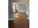 Open living room with hardwood floors and charming archway at 2022 N Olney St, Indianapolis, IN 46218