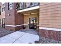 Building entrance showcasing a secure entry system and durable brick construction at 233 E St Joseph St # 3H, Indianapolis, IN 46202
