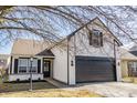 Beautiful two-story home with a well-manicured lawn and an attached two-car garage at 2361 Salem Park Ct, Indianapolis, IN 46239