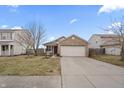 Exterior of a well-maintained single-Gathering home with a two-car garage and a spacious driveway at 294 Bent Stream Ln, Brownsburg, IN 46112