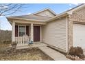 A quaint front porch leads to the entrance of a cozy single-Gathering home at 294 Bent Stream Ln, Brownsburg, IN 46112