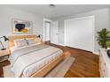 Cozy bedroom with natural wood floors, closet, and large window for great natural light at 3025 E 6Th St, Anderson, IN 46012