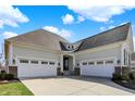 Exterior of a home with three car garage, driveway and landscaped lawn at 3331 Adare Cir, Westfield, IN 46062