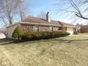 Brick home with manicured lawn on a sunny day at 3534 Country Walk Dr, Indianapolis, IN 46227