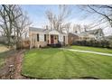 Attractive single-story house boasting a lush green lawn and a walkway leading to the front door at 4035 N Kenwood Ave, Indianapolis, IN 46208