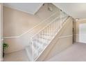 Carpeted staircase with white railing, providing access to upper floors at 4501 N Wheeling Ave # 6A - 201, Muncie, IN 47304