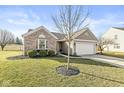 Attractive home with a two-car garage, landscaped front yard, and a mix of brick and siding details at 481 Autumn Springs Ct, Avon, IN 46123