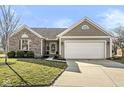 Well-maintained home featuring a two-car garage, appealing brickwork, and a concrete driveway at 481 Autumn Springs Ct, Avon, IN 46123