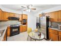 Functional kitchen features neutral countertops, and stainless steel refrigerator at 5108 Chatham Pl, Indianapolis, IN 46226
