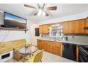 Well-lit kitchen featuring neutral countertops, plenty of cabinets, and eat-in dining area at 5108 Chatham Pl, Indianapolis, IN 46226