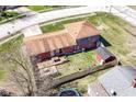 Aerial view of a home with a wooden deck, fenced backyard, and a detached shed at 5414 Honey Comb Ln, Indianapolis, IN 46221