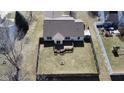 Aerial view of a home with a wooden deck, fenced yard, shed, and ample green space at 7340 Oakview Dr, Avon, IN 46123