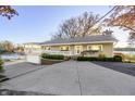 Spacious home with an attached garage, covered porch, and beautifully landscaped front yard at 7780 Paw Paw Dr, Nineveh, IN 46164
