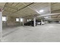Well-lit parking garage with designated parking spots and visible support beams at 802 N Meridian St # 204, Indianapolis, IN 46204