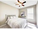 Cozy bedroom with neutral tones, a ceiling fan, and comfortable furnishings at 8729 Dorill Creek Ln, Indianapolis, IN 46259