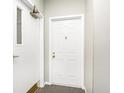 Interior image of a unit entry door, painted white with gold hardware and unit number 101 at 8820 Yardley Ct # 101, Indianapolis, IN 46268