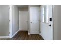 Bright hallway featuring three white doors, leading to different areas of the house at 9161 Warwick Rd, Indianapolis, IN 46240