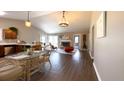 Bright open-concept living room and kitchen with vaulted ceilings and wood floors at 9161 Warwick Rd, Indianapolis, IN 46240
