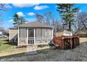 A cozy screened porch extends from the home, offering a relaxing outdoor living space at 1023 Helen Dr, Indianapolis, IN 46240