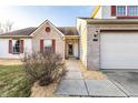 Charming home with brick and vinyl siding, two-car garage and well-maintained landscaping at 10893 Cannonade Ct, Indianapolis, IN 46234