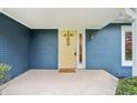 Inviting front porch with a yellow door and well maintained greenery at 1250 W 141St St, Carmel, IN 46032