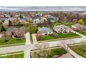 Overhead shot of a neighborhood showcasing the house and surrounding properties and landscaping at 12526 Pembrooke Cir, Carmel, IN 46032
