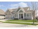Craftsman-style home with manicured lawn and attractive landscaping at 1499 Avondale Dr, Westfield, IN 46074