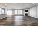 Spacious living area with fireplace, large windows, and wood-look flooring, offering ample natural light at 2352 Somerset Cir, Franklin, IN 46131