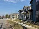 A line of new homes with classic architectural design elements in a neighborhood street setting at 2833 Macpherson Ave, Indianapolis, IN 46205