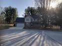 Beautiful two-story home with attached garage, brick accents, and a spacious driveway at 293 Spruce Ct, Martinsville, IN 46151