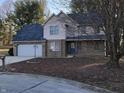 Attractive two-story house with brick and siding exterior, an attached garage, and landscaped yard at 293 Spruce Ct, Martinsville, IN 46151
