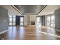 Spacious living room with a decorative fireplace and an abundance of natural light at 30 W Main St # 3D, Carmel, IN 46032