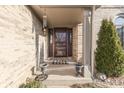 Inviting front porch with a decorative welcome mat and a charming covered entryway at 397 Linden Ridge Trl, Greenwood, IN 46142