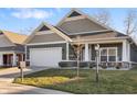 Charming single-Gathering home with a manicured lawn and a two-car garage at 4313 W Hidden Preserve Cv, New Palestine, IN 46163