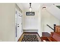 Bright foyer featuring a coat rack with bench and beautiful hardwood flooring at 725 E County Rd 600 N, Pittsboro, IN 46167