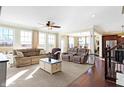 Spacious living room with lots of natural light, hardwood floors, and comfortable seating at 725 E County Rd 600 N, Pittsboro, IN 46167